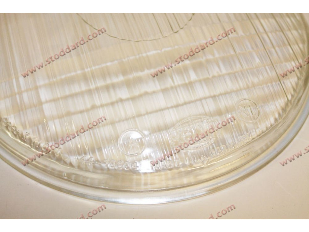 Fluted Hella Headlight Lens for 356, Symmetrical, Marked VW at top.