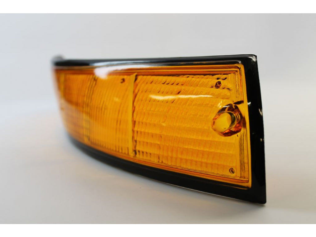 USA-spec Front Turn Signal Lens, Right with Black Trim.