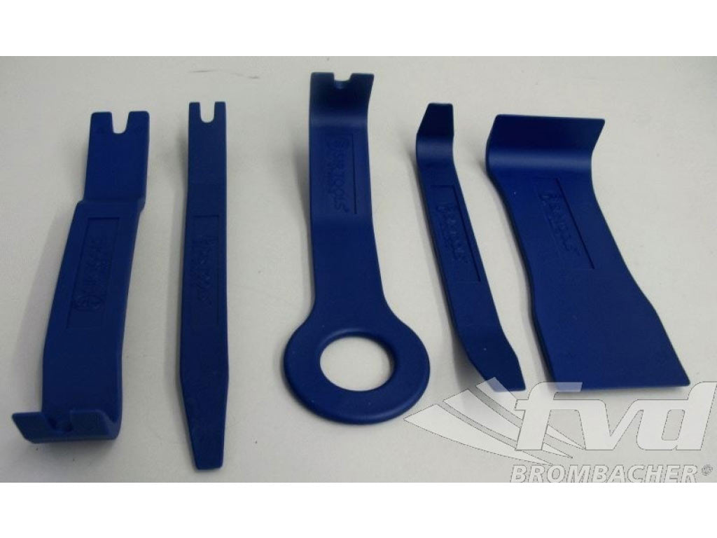 Tool kit for disassembly of door panels, trim strips, dashboard